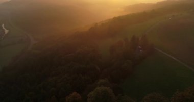 Beautiful greeny mountains are covered with fog during the sunset in Heilbronn, Germany. Flying copter. 4k footage