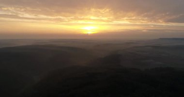 Beautiful sunset in Heilbronn, Germany. Flying copter over misty town. 4k footage