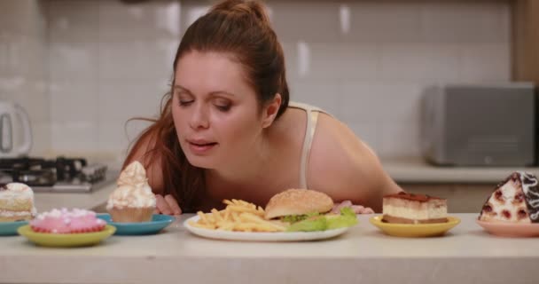 Obese Woman Happily Enjoying Smell French Fries Burger Different Cupcakes — Video Stock