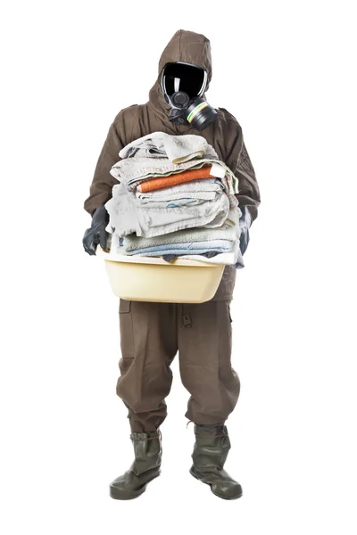 Man in Hazard Suit holding dirty towels and looking at the camer — Stock Photo, Image