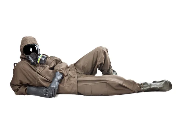Man in Hazard Suit layng on the ground — Stock Photo, Image
