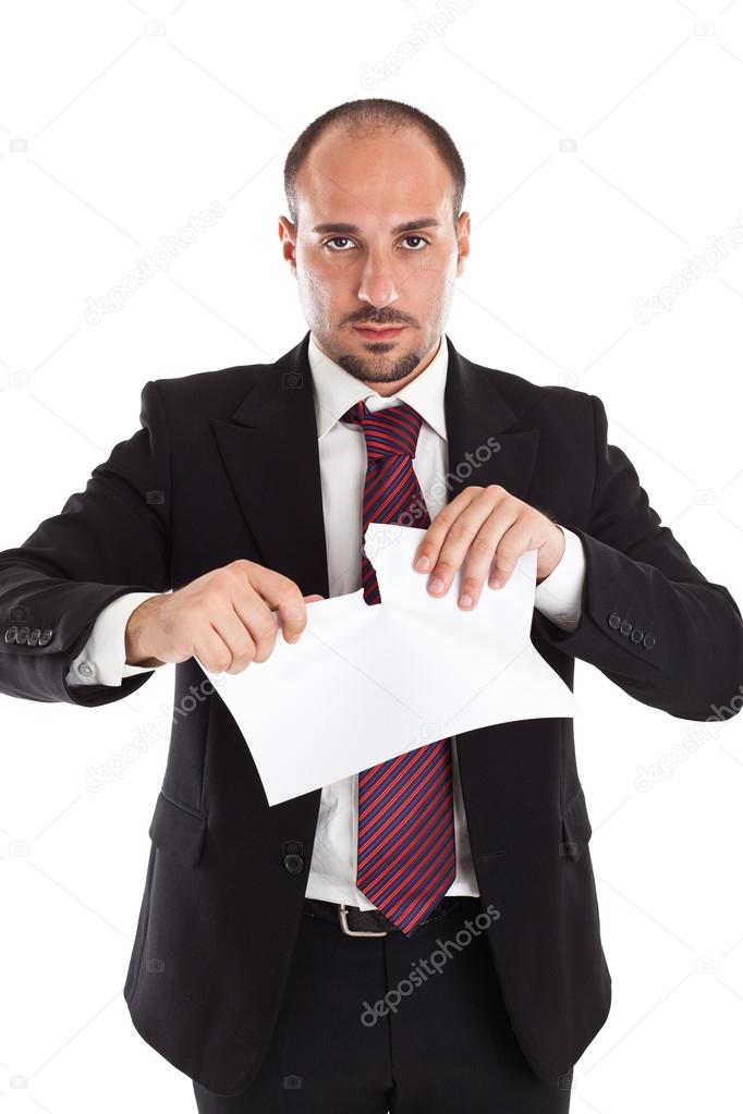 Businessman tearing paper