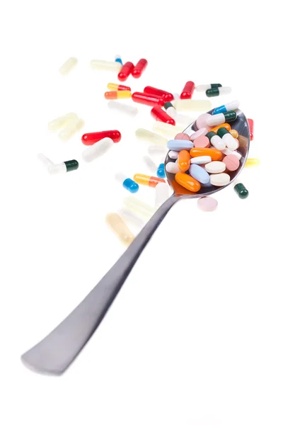 Löffel Tabletten senkrecht — Stockfoto