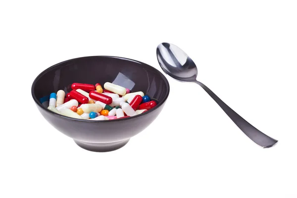 Tigela cheia de comprimidos — Fotografia de Stock