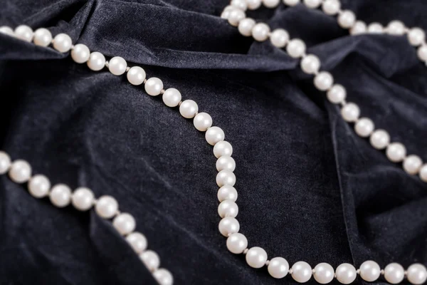 Pearls on black velvet — Stock Photo, Image