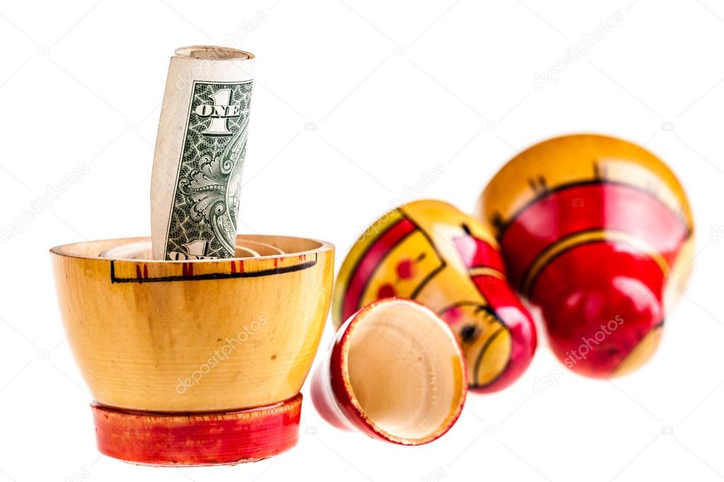 Dollar within Matryoshka doll