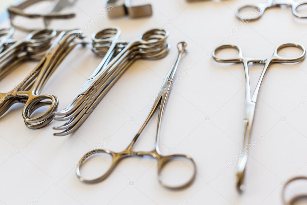 Arranged surgical clamps Stock Photo by ©dlpn 50273945