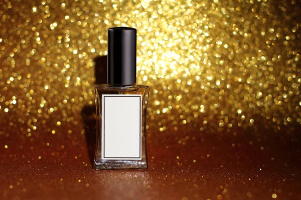 Perfume Glass Bottle Shiny Glitter Background Golden Bokeh — 图库照片