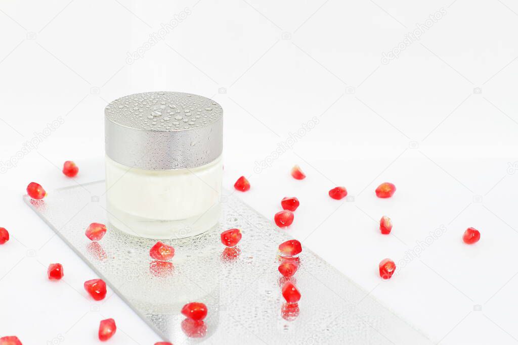 Face treatment cosmetics with pomegranade and water drops