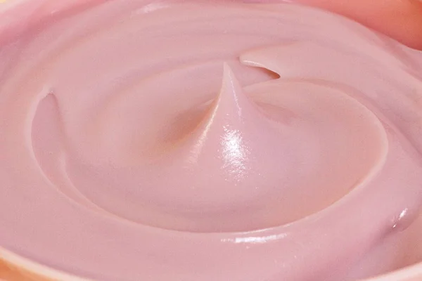 Pink cosmetic cream texture, creamy background