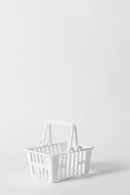 White plastic shop basket, empty toy supermarket carry