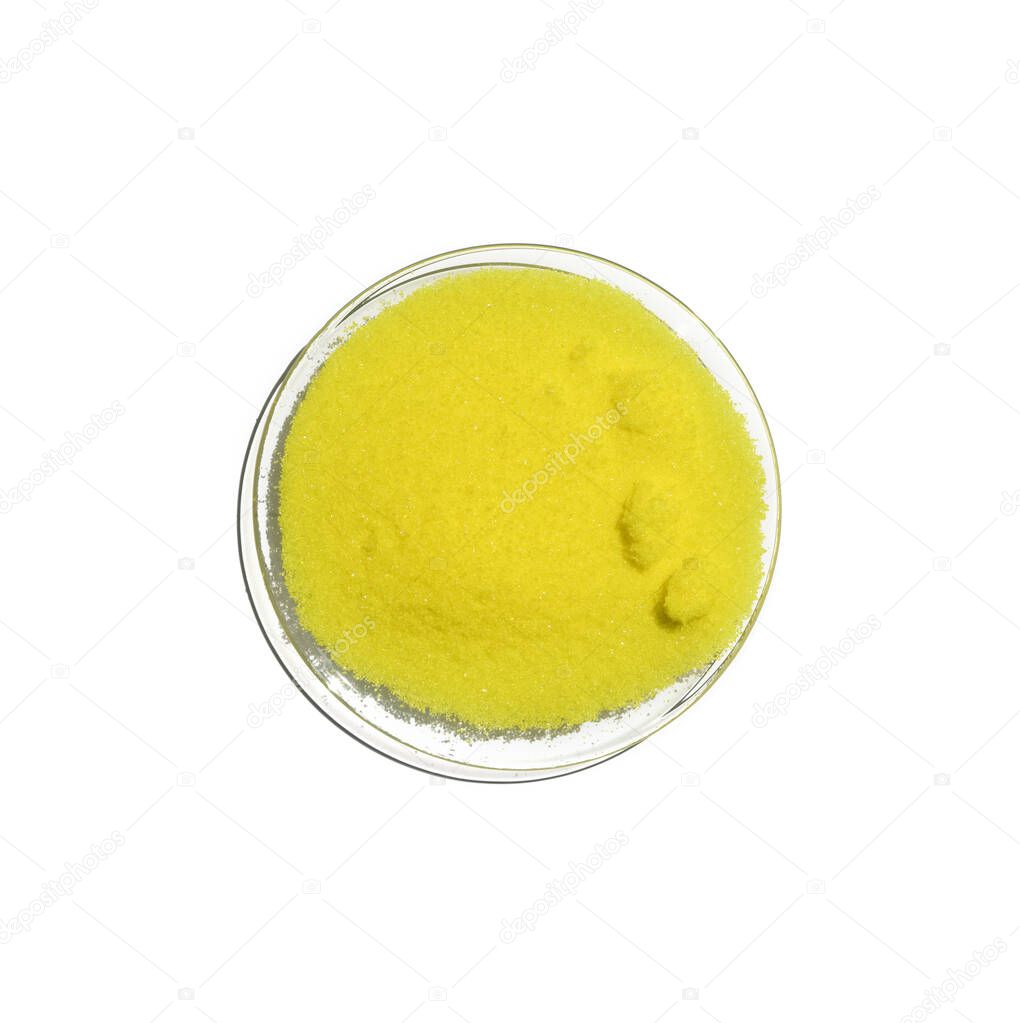 Close up chemical ingredient on white laboratory table. Potassium Chromate powder in Chemical Watch Glass. Top View