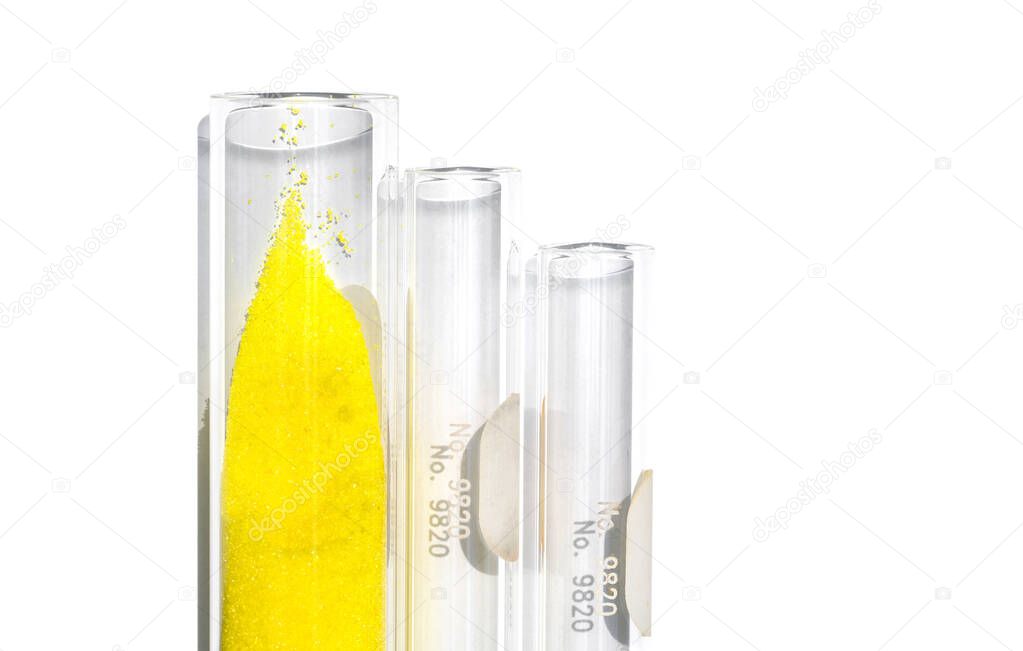 Closeup chemical ingredient on white laboratory table. Potassium Chromate powder in test tube.