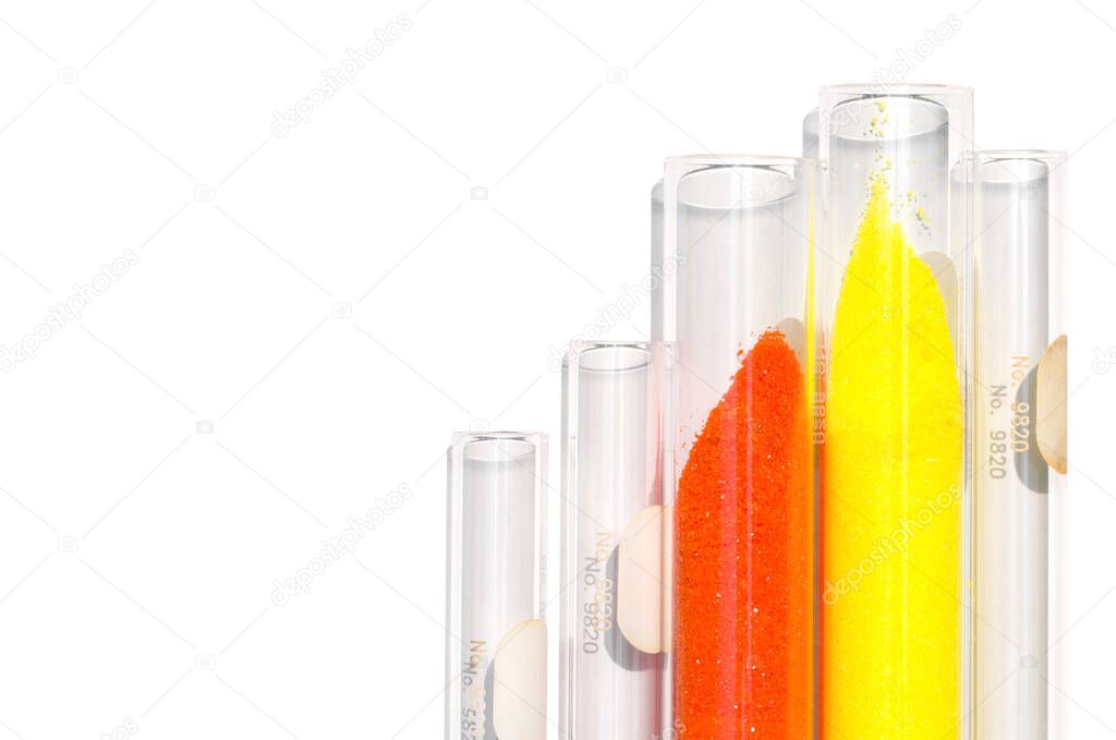Closeup chemical ingredient on white laboratory table. Potassium Ferricyanide and Potassium Chromate powder in test tube.