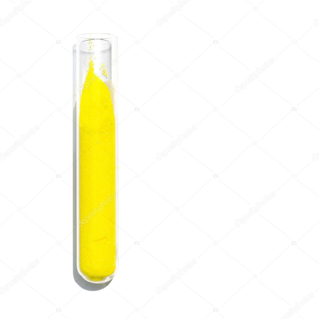Closeup chemical ingredient on white laboratory table. Potassium Chromate powder in test tube.