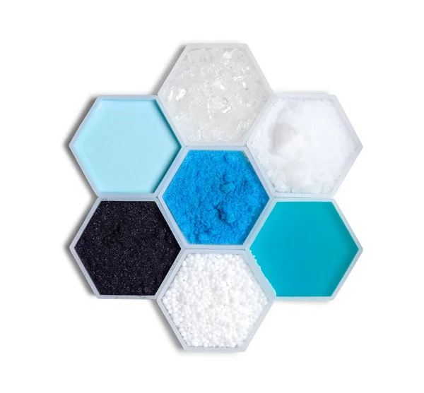 Chemical ingredient in hexagonal molecular shaped container. Sodium Thiosulfate, Sodium Hydroxide Pellets, Shampoo Liquid, Urea, Potassium Permanganate, Hair Conditioner and Copper (II) Sulfate.