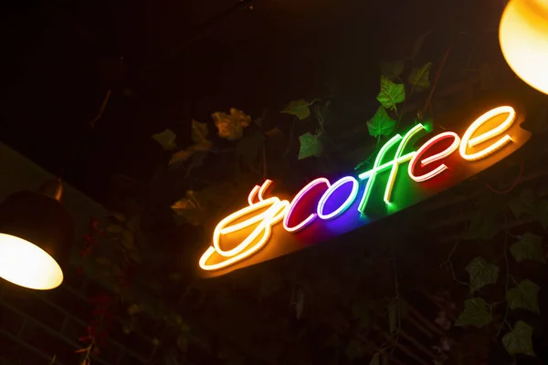 Colorful Coffee Logo, illuminated with neon lights