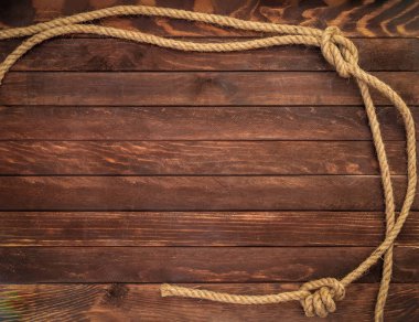 Kenevir ipli koyu kahverengi tahtalardan yapılmış ahşap arka plan. Güverte dokusu.