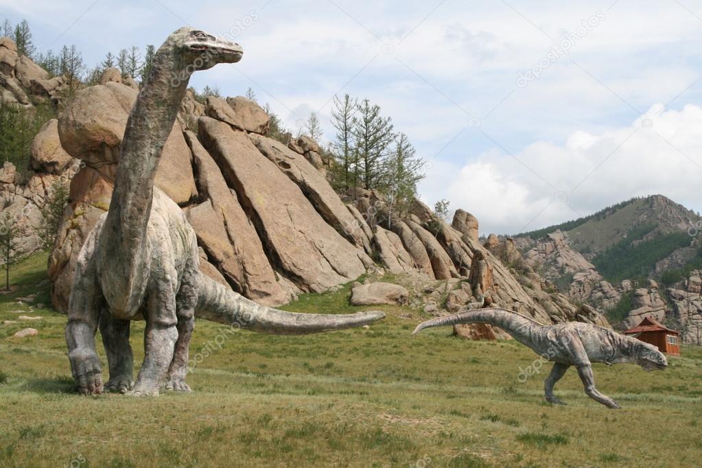 Stone dinosaurs in the background of the mountains in Mongolia