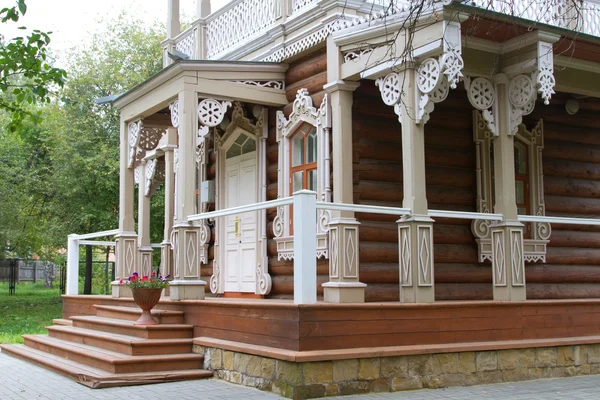 The porch and the windows of the first floor wooden house with decorations — Stock Photo, Image