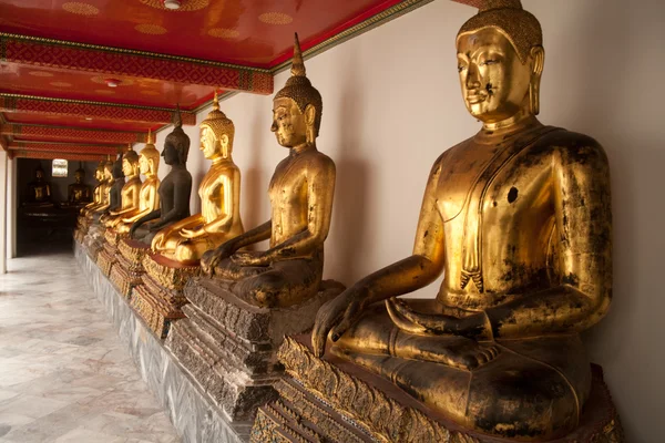 Several gold statues of Buddha in the temple — Stock Photo, Image