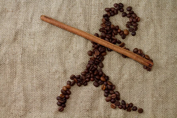 Figura dardo, forrado com grãos de café — Fotografia de Stock