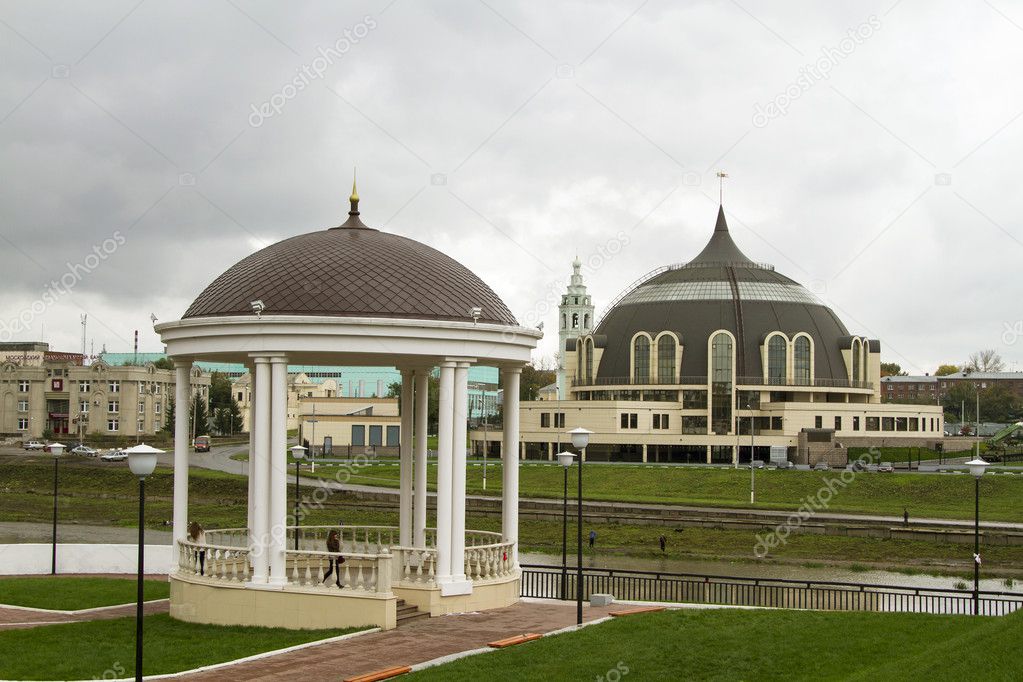 Gazebo on the shore of a small river in Tula and the urban landscape