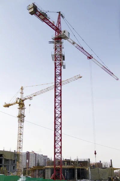Under construction and monolithic tower crane — Stock Photo, Image