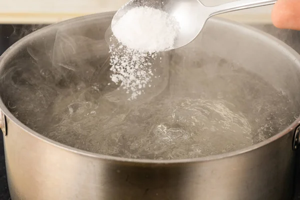 Pour Salt Metal Pot Boiling Water Your Hand — Stock Photo, Image