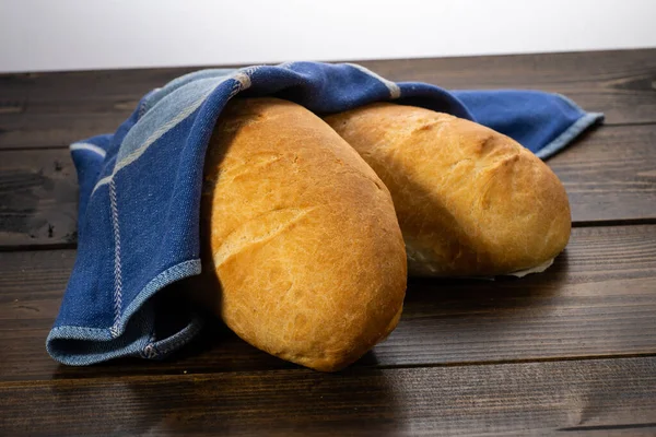 Fresh Baked Loaves Bread Lie Dark Wooden Table — Stock Photo, Image