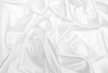 Beyaz saten, ipek ve pamuk hazineleri. Soyut beyaz kumaş dokusu arkaplanı. Kumaş yumuşak dalga.
