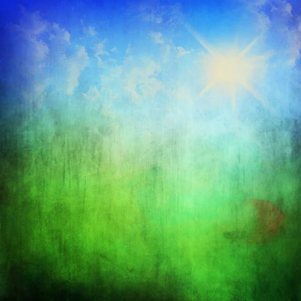 Grunge zelená pole a modré nebe — Stock fotografie