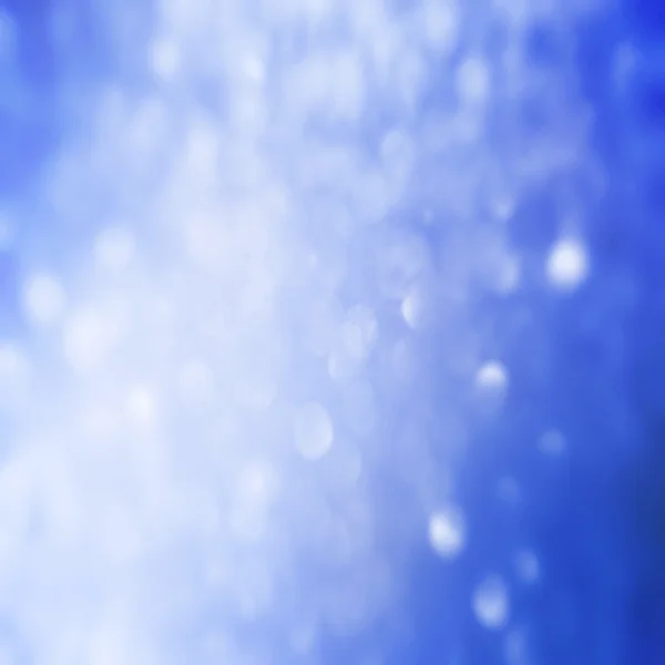 Blauwe bokeh abstracte licht achtergrond. — Stockfoto