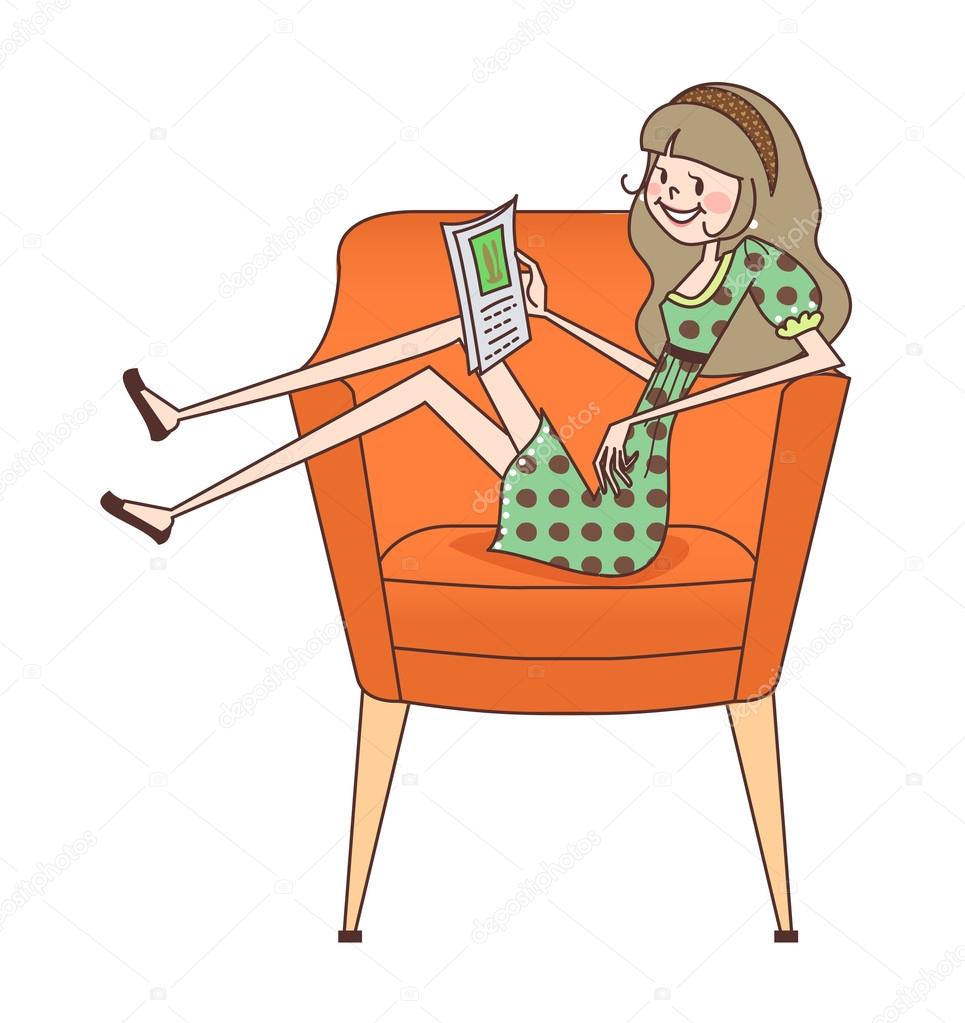 Cute girl reading a book sitting on sofa