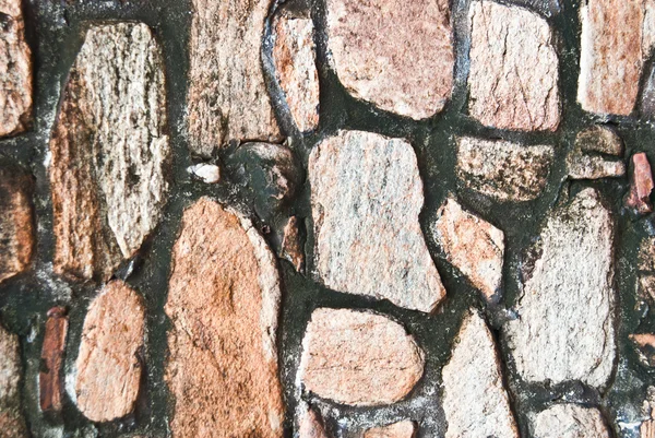 Detalhe de pedra padrão de rocha-parede feita de rocha — Fotografia de Stock