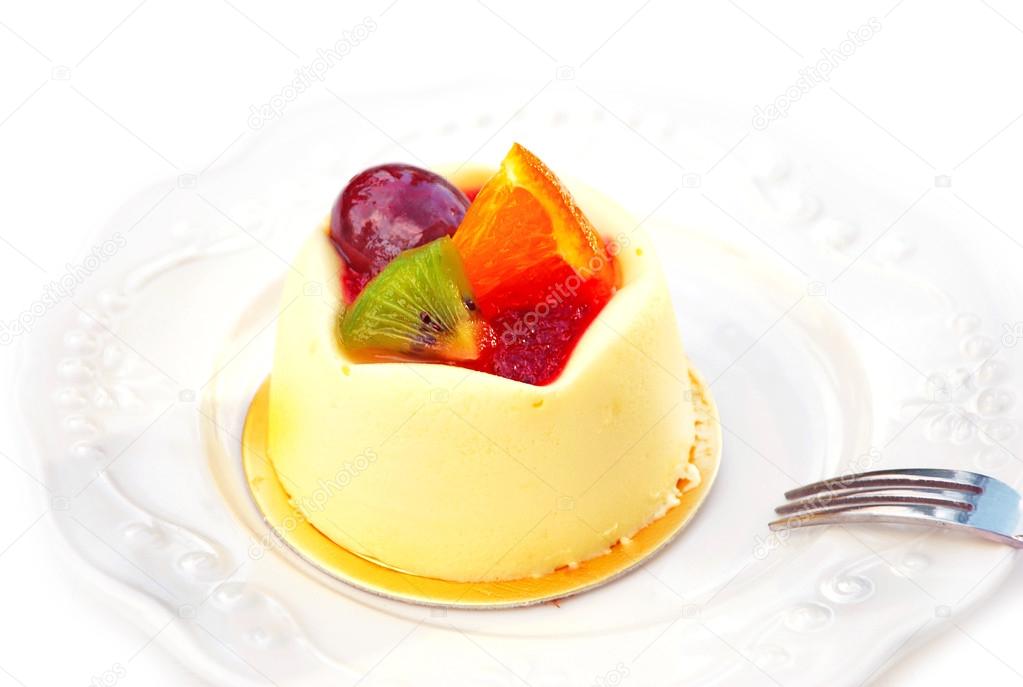 Vanilla pudding with fruit isolated on a white background