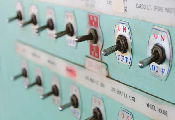 Close up shot of toggle switch on off button panel on cargo vessel — Stock Photo, Image