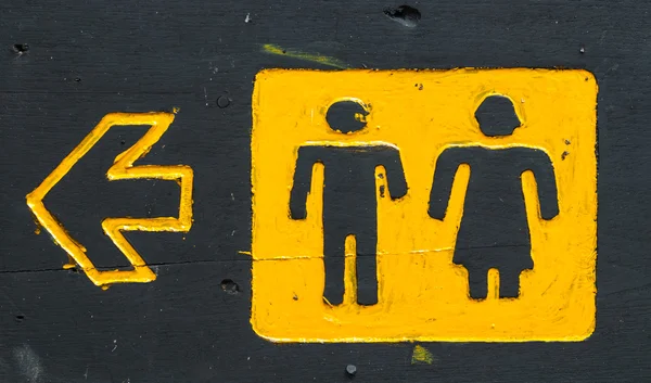 Zwarte Raad houten mannelijke en vrouwelijke WC teken en richting — Stockfoto