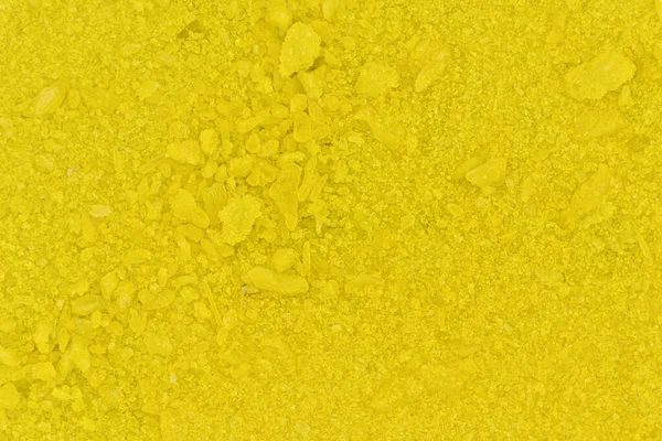 Piccoli cristalli giallo brillante di cromato di sodio, foto microscopio, larghezza dell'immagine 16mm — Foto Stock