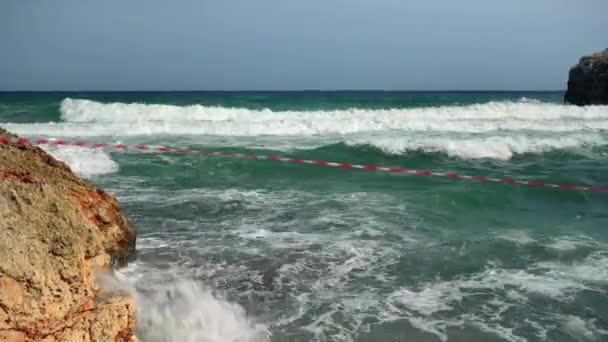 Red White Tape Beach Prevent People Swimming Wild Sea Windy — Stock Video