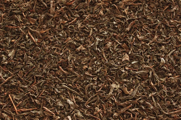 Czarna herbata w tle — Zdjęcie stockowe