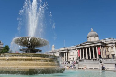 London, UK, 11 July 2022: The Trafalgar Square Fountain and National Gallery, Trafalgar Square, mid-day. 