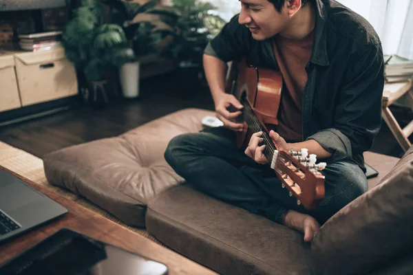 Young Man Relax Playing Guitar While Sitting Sofa Bed Living — 图库照片