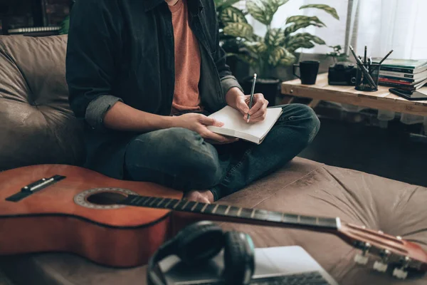 Young Man Relax Playing Guitar While Sitting Sofa Bed Living — Stockfoto