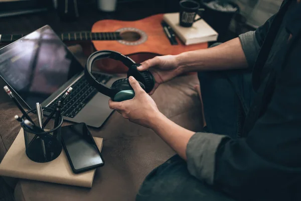 Men Holding Headphone Wearing Listening Music Sofa Home Check Melody — Foto de Stock