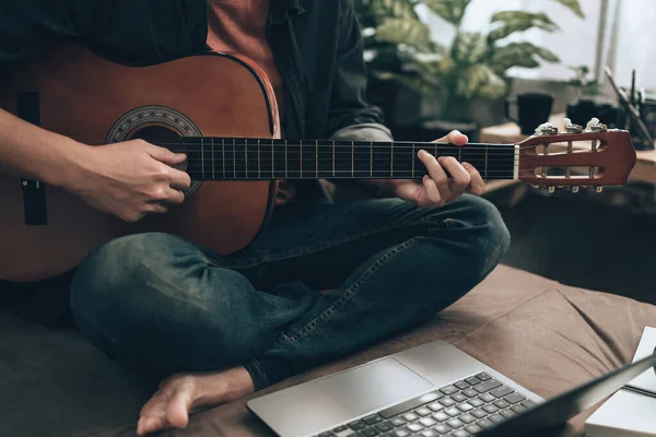 Young Man Relax Playing Guitar While Sitting Sofa Bed Living — Foto Stock