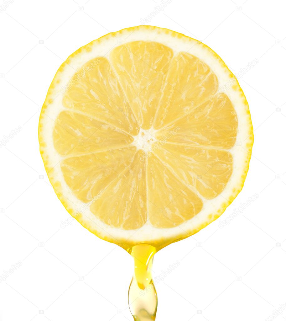 Fragment of lemon with water drops on the white background