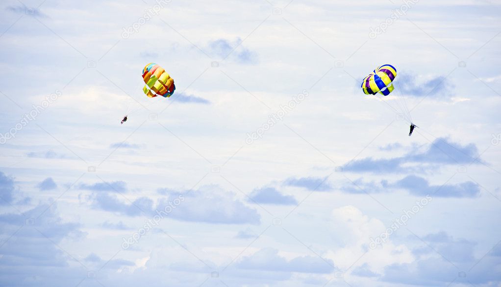 parachutes on blue sky