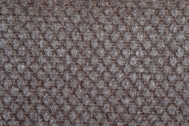 Gri kumaş dokusu. Mobilya döşeme tekstili. Kabartmalı desen. Dokuma iplikleri. Malzeme yumuşak dokunuşlu. Minimalizm kavramı. Arkaplan ya da duvar kağıtları için yüksek detaylı makro fotoğrafçılık.