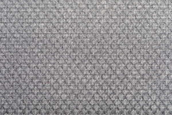 Textura de tela gris. Tejidos de tapicería para muebles. Patrón en relieve. Fibras tejidas. El material es de tacto suave. Concepto minimalista. Fotografía macro de alto detalle para fondos de pantalla o fondos de pantalla. — Foto de Stock